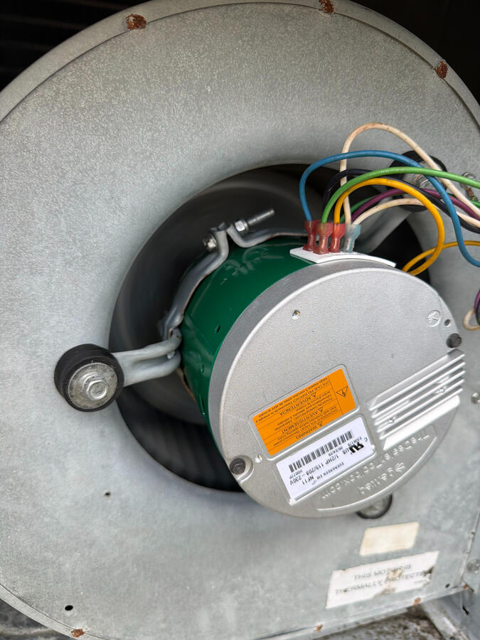 Efficiency starts with the details. This close-up of a high-performance HVAC blower motor shows the precision required during a professional parts replacement. By focusing on the technical health of your fan assembly, we keep your air moving efficiently an Efficiency starts with the details. This close-up of a high-performance HVAC blower motor shows the precision required during a professional parts replacement. By focusing on the technical health of your fan assembly, we keep your air moving efficiently an