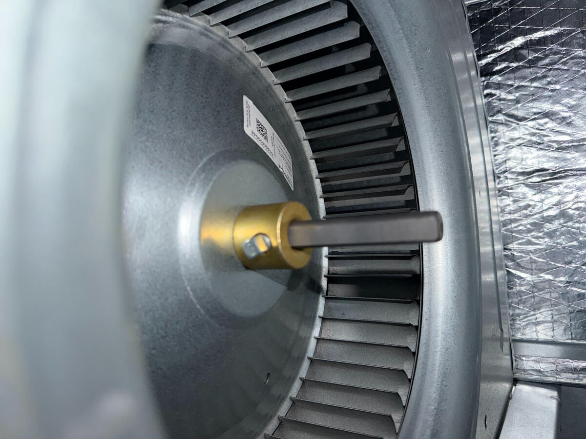 Efficiency starts with the details. This close-up of a high-performance HVAC blower motor shows the precision required during a professional parts replacement. By focusing on the technical health of your fan assembly, we keep your air moving efficiently an