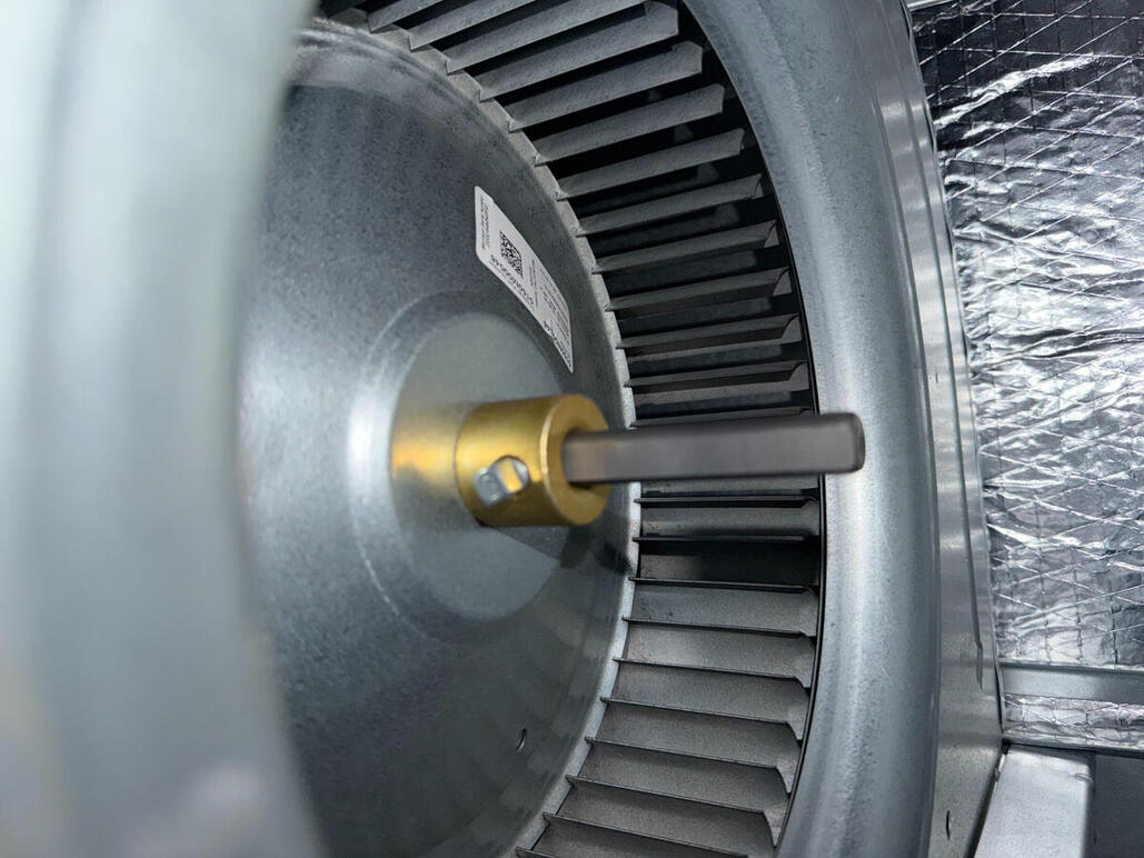 Efficiency starts with the details. This close-up of a high-performance HVAC blower motor shows the precision required during a professional parts replacement. By focusing on the technical health of your fan assembly, we keep your air moving efficiently.